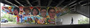 Frida Kahlo, right, is among the local and international heroes depicted on a South Toledo mural.