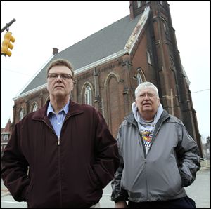In this file photo, Rick Napierala, left, and Tom Robakowski, stand outside the former St. Anthony Catholic Church.