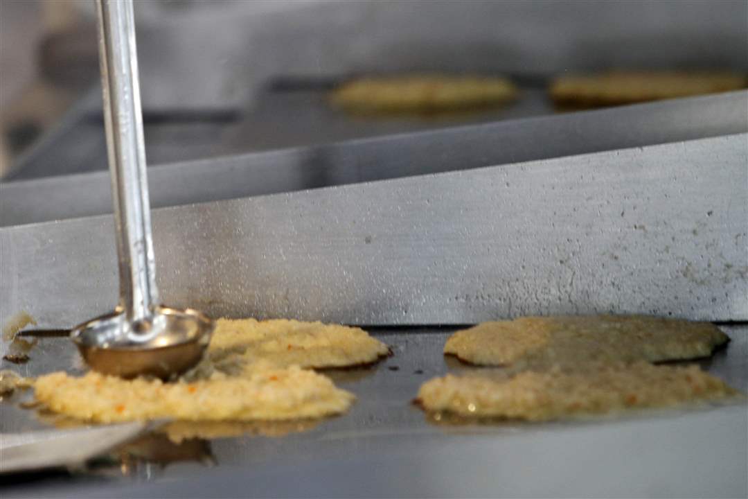 German-potato-pancakes-sizzle-on-stove