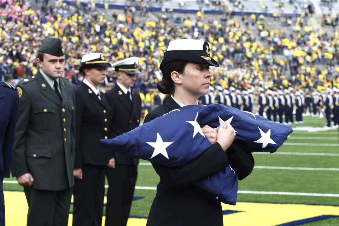 UM-Navy-ROTC-member-Brooke-Schaffer-carries-in-the-American-Flag