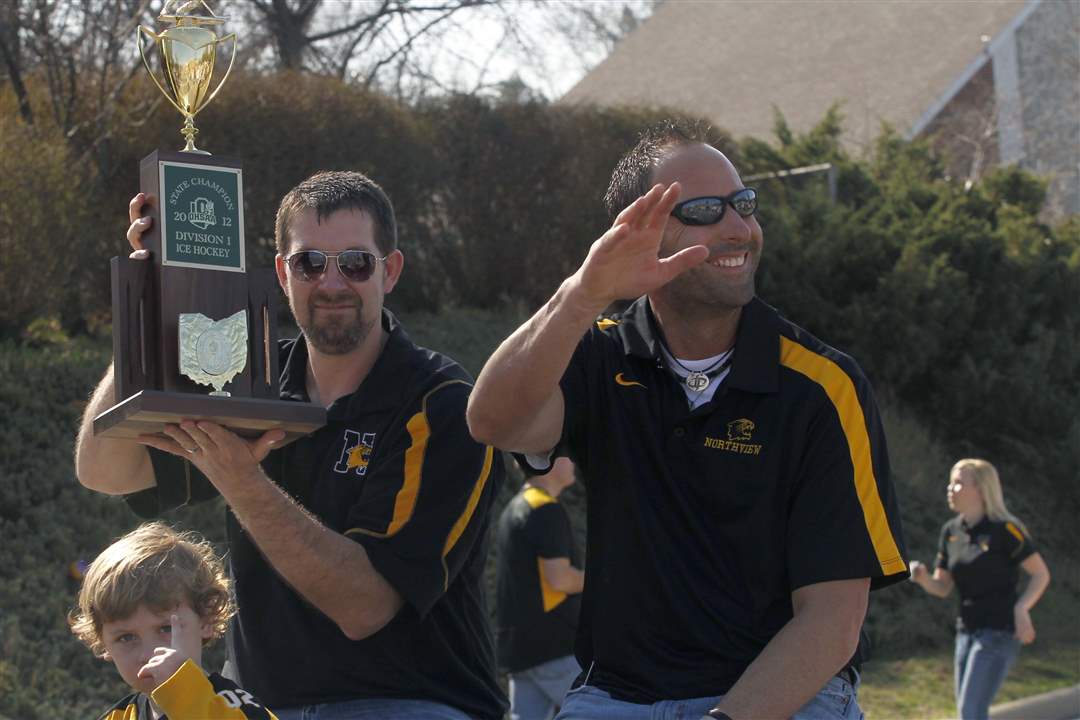 Northview-hockey-offensive-coach-Steve-Elliott-holds-the-trophy