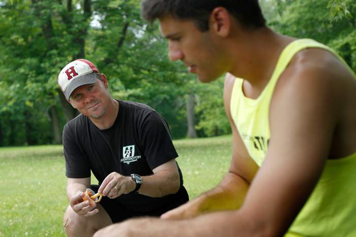 Soccer-coach-Russ-Lawson-left-talks-with-Isaac-Beal-right