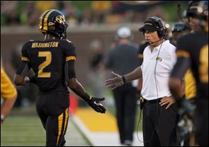 Missouri head coach Gary Pinkel, right, congratulates player L'Damian Washington, left, after Washington scored a touchdown during the third quarter of an NCAA college football game against Murray State, Saturday.