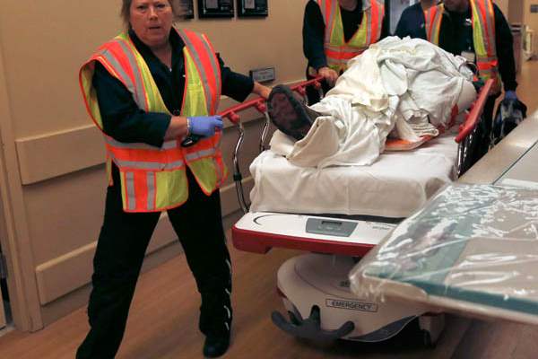 Life-Flight-workers-wheel-a-vehicle-accident-trauma-patient-in