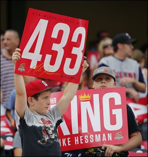 Toledo Mud Hens fans hold signs in honor of Mike Hessman, who was nicknamed 