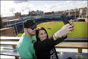 Sari Rahman and Kayla Hopson take a picture from the roof during a St. Patrick's Day party in the Fleetwood Building at Hensville during last year's event.