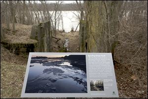 A plaque provided by the Metroparks identifies the area where the Bowing Green Fault runs through Farnsworth Metropark and across the Maumee River. 