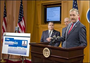 State Auditor David Yost and legislators last week pitched a plan to address food-stamp fraud, saying placing a name on the cards received from the state would deter drug dealers who use the cards as underground currency.