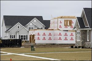 Construction is ongoing on a handful of homes on Sweetgum Lane in the Crimson Hollow development in Monclova Township. The supply of properties for sale nationwide has been relatively low despite additional construction.