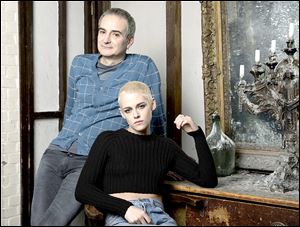 Kristen Stewart, right, and writer-director Olivier Assayas pose for a portrait to promote their film ‘Personal Shopper.’