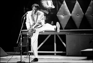 Chuck Berry performs during a concert celebration for his 60th birthday at the Fox Theatre in St. Louis, Mo. Berry has died at the age of 90. 