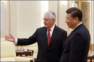 China's President Xi Jinping, right, meets with U.S. State of Secretary Rex Tillerson at the Great Hall of the People in Beijing, China Sunday.