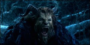 This image released by Disney shows Dan Stevens as The Beast in a live-action adaptation of the animated classic 