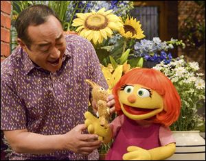 This image released by Sesame Workshop shows Julia, a new autistic muppet character debuting on the 47th Season of 'Sesame Street' on April 10 on both PBS and HBO.
