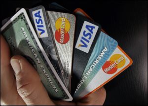 Consumers nationwide cut their credit card debt significantly between 2006 and 2015, but no states saw a bigger drop than Ohio and Michigan.