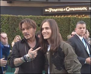 Johnny Depp poses with Bowling Green native Anthony  De La Torre at the premiere of ‘Dead Men Tell No Tales.’ Mr. De La Torre wanted to work with Mr. Depp since childhood.