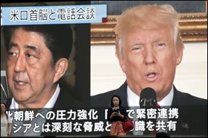 People walk by a TV news program showing the images of Japanese Prime Minister Shinzo Abe, left, and U.S. President Donald Trump while reporting North Korea's nuclear test, in Tokyo on Monday. The leaders of South Korea and Japan have agreed to work together to build support for further sanctions against North Korea following its latest nuclear test. 