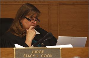 Judge Stacy Cook listens to testimony during the Ray Abou-Arab arson/murder trial at the Lucas County Common Pleas Court in Toledo.
