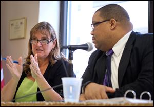 Lucas County Common Pleas Court Judges Stacy Cook, left, and Ian English, participate in a panel discussion about about drug court, Wednesday, April 27, 2016, at the Toledo Bar Association office in Toledo. 