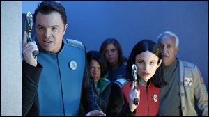 This image released by Fox shows, from left, Seth MacFarlane, Penny Johnson Jerald, Adrianne Palicki, Halston Sage and guest star Brian George in 