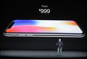 Phil Schiller, Apple's senior vice president of worldwide marketing, discusses features of the new iPhone X at the Steve Jobs Theater on the new Apple campus on Tuesday, Sept. 12, 2017, in Cupertino, Calif. 