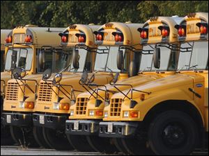 School buses lined up at the Toledo Public Schools bus garage. TPS kicked off a campaign Wednesday seeking voter support for a 5-year, 6.5-mill operating levy.