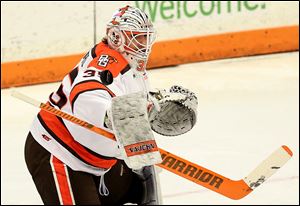 Bowling Green State University goalie Ryan Bednard blocks a shot against Michigan Tech last season. He stopped 20 shots Saturday to backstop the Falcons to a 4-1 win at Minnesota State.