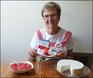 Jean Gottfried with her 2006 entry to the Pillsbury Bake-Off contest at her home in Upper Sandusky. She was a finalist with her creation, an Italian Cream Pie with Strawberry Sauce.