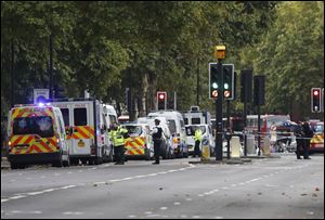 Britain's police and emergency services at the scene of an incident in central London on Saturday. London police say emergency services are outside the Natural History Museum in London after a car struck pedestrians.