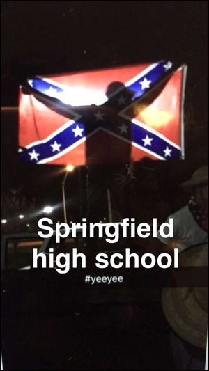 Screenshots from social media show young people displaying Confederate flags Monday night outside Springfield High School. District staff are investigating.