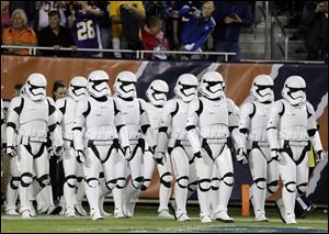 Stormtroopers march down the field during the halftime of an NFL football game between the Chicago Bears and the Minnesota Vikings, Monday, Oct. 9, in Chicago. 