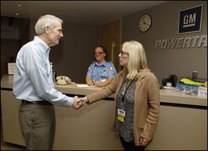 Sen. Rob Portman is greeted by plant manager Nancy Laubenthal at the General Motors Toledo Transmission plant, Thursday.