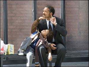 This undated publicity photo released by Columbia Pictures, shows actors Jaden Christopher Syre Smith, left, and Will Smith in a scene from the film 