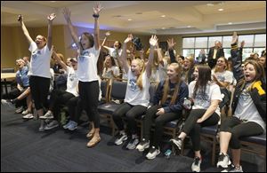 UT women's soccer players react to hearing the team's name called in the NCAA tournament selection show. The Rockets won a MAC title for the first time since 2011.