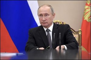 Russian President Vladimir Putin attends a meeting of his Security Council in Moscow, Russia, Wednesday, Nov. 8.