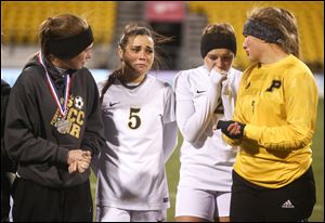 Perrysburg players from left Erica Culp, Riley Tilton, Mackenzie Thomas and Lily Yoder react to a 1-0 loss to Loveland in the state championship game at MAPFRE Stadium in Columbus.