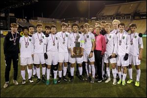 Ottawa Hills players with the state runner-up trophy after Saturday's 1-0 loss to Cincinnati Summit Country Day at MAPFRE Stadium in Columbus.