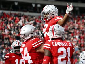 Ohio State running back J.K. Dobbins celebrates his touchdown against Michigan State. A convincing win over the Spartans and upsets elsewhere put the Buckeyes back in the Top 10 of the AP Poll.