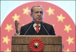 Turkey's President Recep Tayyip Erdogan gestures as he delivers a speech at a tourism council in Ankara, Turkey.