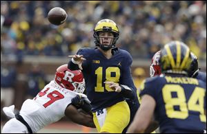 Michigan quarterback Brandon Peters (18) is the No. 1 quarterback on the roster entering bowl practices.