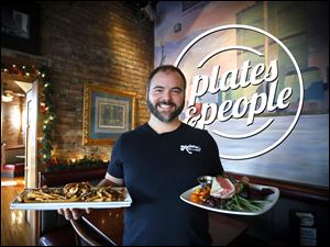 Zach Lahey with his Salade Niçoise and Poutine at Manhattan's Pub 'N Cheer on Adams St. in UpTown Toledo. 