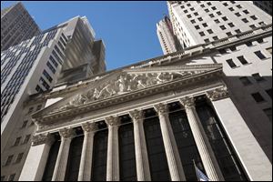 This Dec. 21, 2016, file photo shows the New York Stock Exchange. US stocks rise for the fourth day in a row as the government's December 2017 jobs report shows strong hiring in manufacturing and construction and an increase in factory orders.