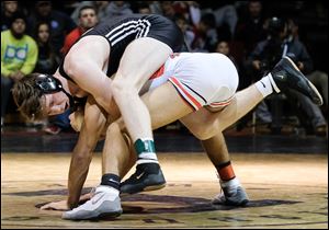 Genoa’s James Limongi, top, defeats Wauseon’s Xavier Torres in overtime to win the 160-pound championship match at the Perrysburg Invitational Tournament.