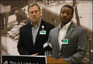 Dr. David Mierzwiak, vice president of Medical Affairs, left, and Greg Braylock, Jr., associate vice president of Operations, update the public about the busy status of the Emergency Room at the Toledo Hospital.