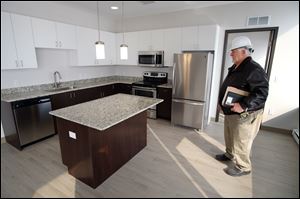 Howard Olsen, construction manager for the Eyde Company shows off a new apartment in the Tower on the Maumee on Thursday.