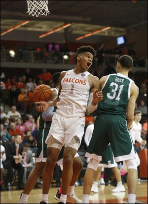 BGSU's Demajeo Wiggins reacts after teammate Derek Koch scored to bring the Falcons within 5 points of Eastern Michigan Saturday at the Stroh Center. Bowling Green rallied from 19 points down to beat the Eagles in overtime.
