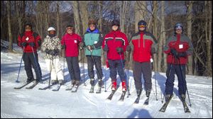 Clyde Brasher, center, still hits the ski slopes with the Toledo Ski Club at the age of 90.