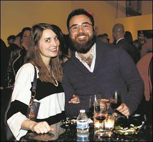 Britney McSweeney, left, and Danny Woodcock attended the kickoff event for Restaurant Week Toledo Thursday, February 22, 2018, at the Secor Building in downtown Toledo. 