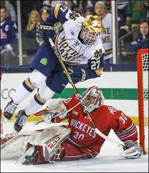 Notre Dame's Bobby Nardella flips as he hits Ohio State's Sean Romeo (30) during a game earlier this year. The Fighting Irish and Buckeyes finished the regular season in first and second, respectively, in the Big Ten.
