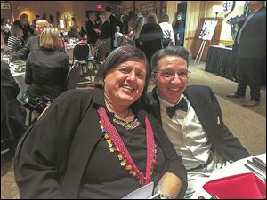 Susan Conda and Doug Adams-Amman share a laugh during a dinner to benefit the Toledo Zoo and Aquarium.